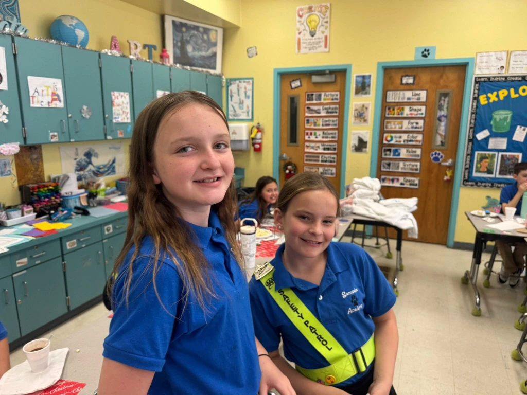 students volunteering at school