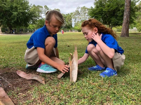 students working together outside on a project