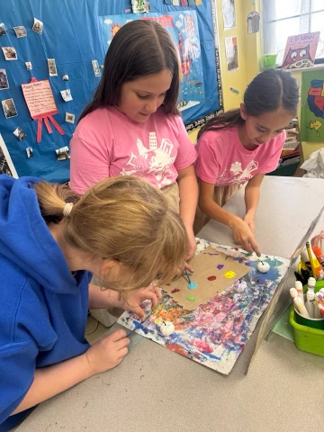 students completing an art project